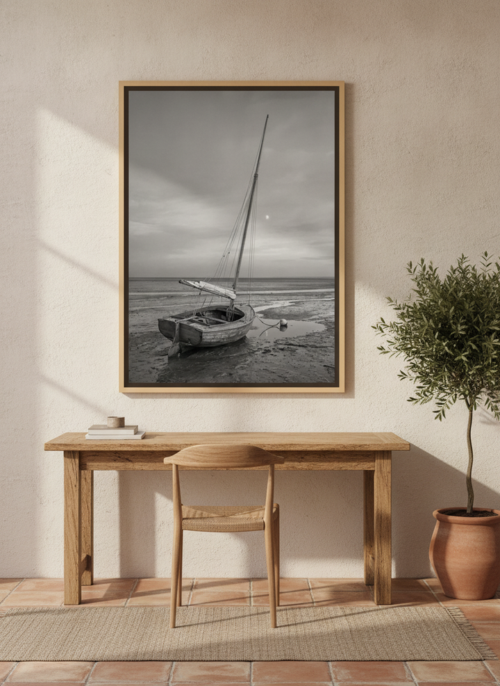 Canvas wall art with a natural timber surround styled on the wall in a Mediterranean home office
