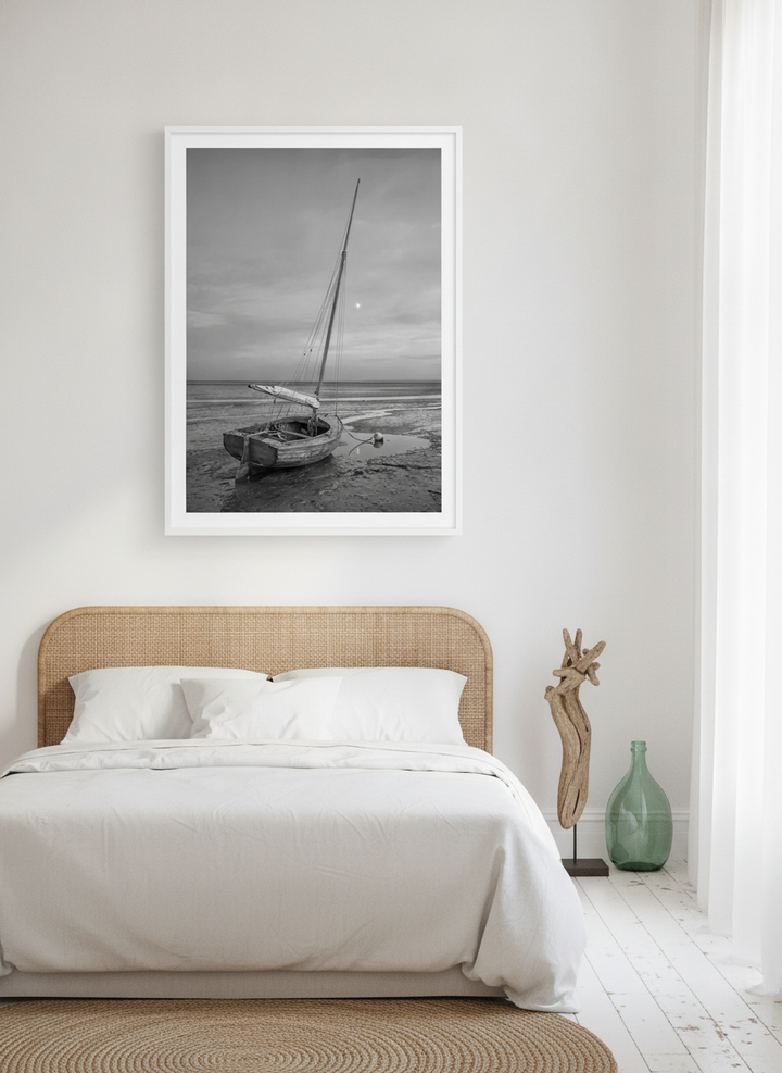 Oversized statement modern wall art print styled on the wall in a coastal bedroom