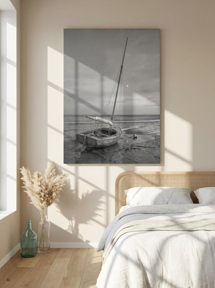 Stretched canvas wall art styled on the wall in a coastal bedroom