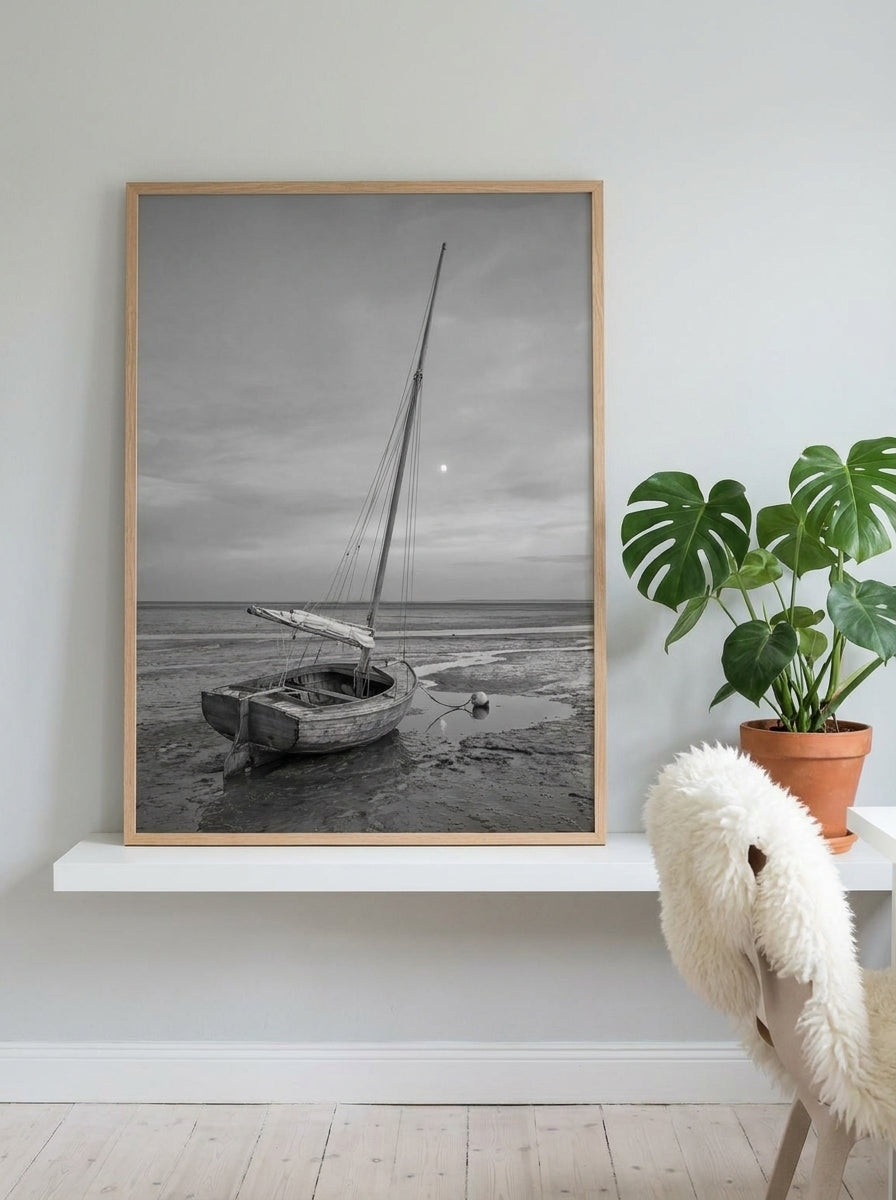Modern wall art print standing on a shelf in a bright Scandinavian home office