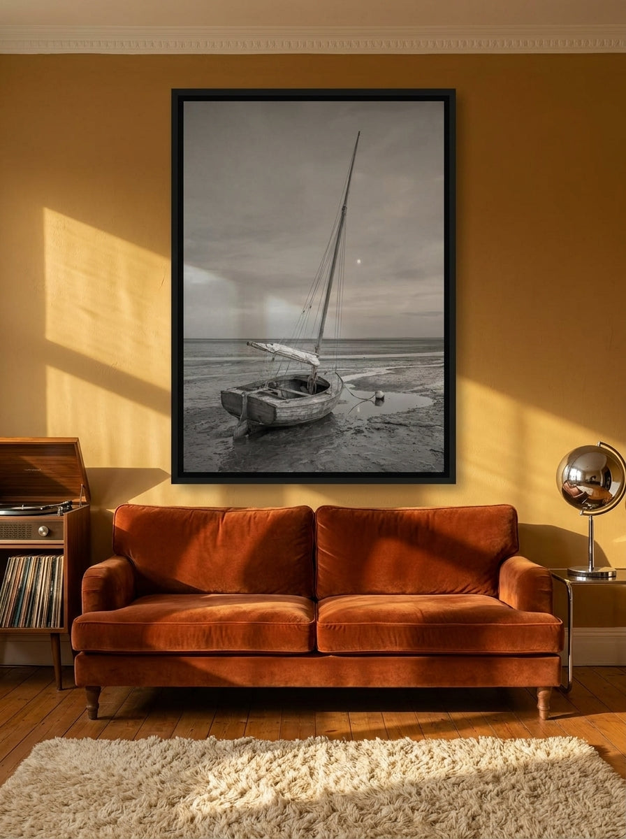 Oversized statement canvas wall art with a black surround styled on the wall in a retro 70s living room