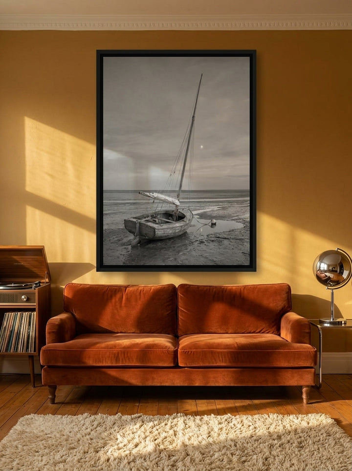Oversized statement canvas wall art with a black surround styled on the wall in a retro 70s living room
