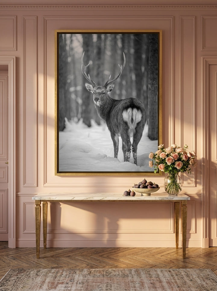 Oversized statement canvas wall art with a gold leaf surround styled on the wall in a Parisian living room