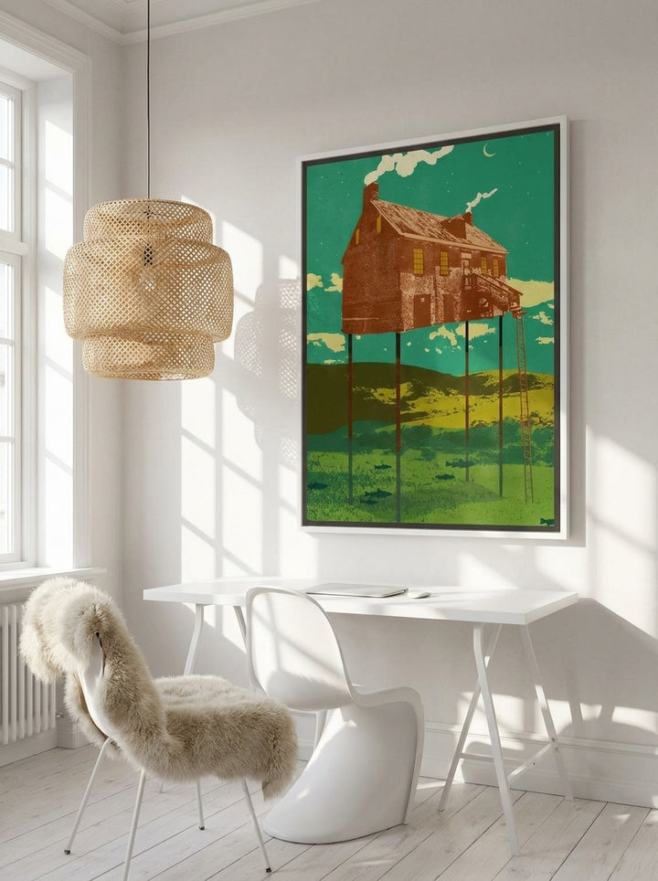 Canvas wall art with a white surround styled on the wall in a bright Scandinavian home office
