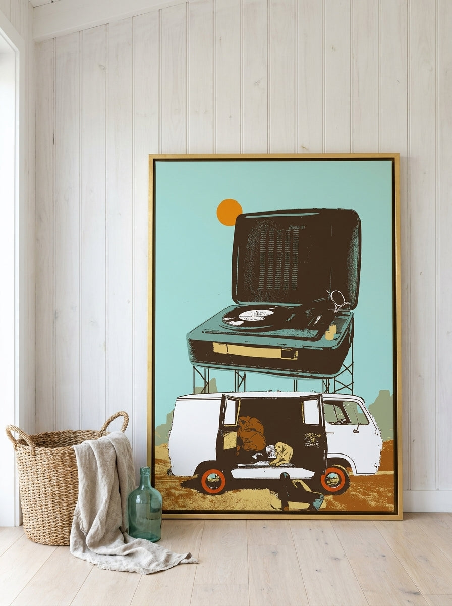 Oversized statement canvas wall art with a gold leaf surround leaning against the wall in a coastal home office