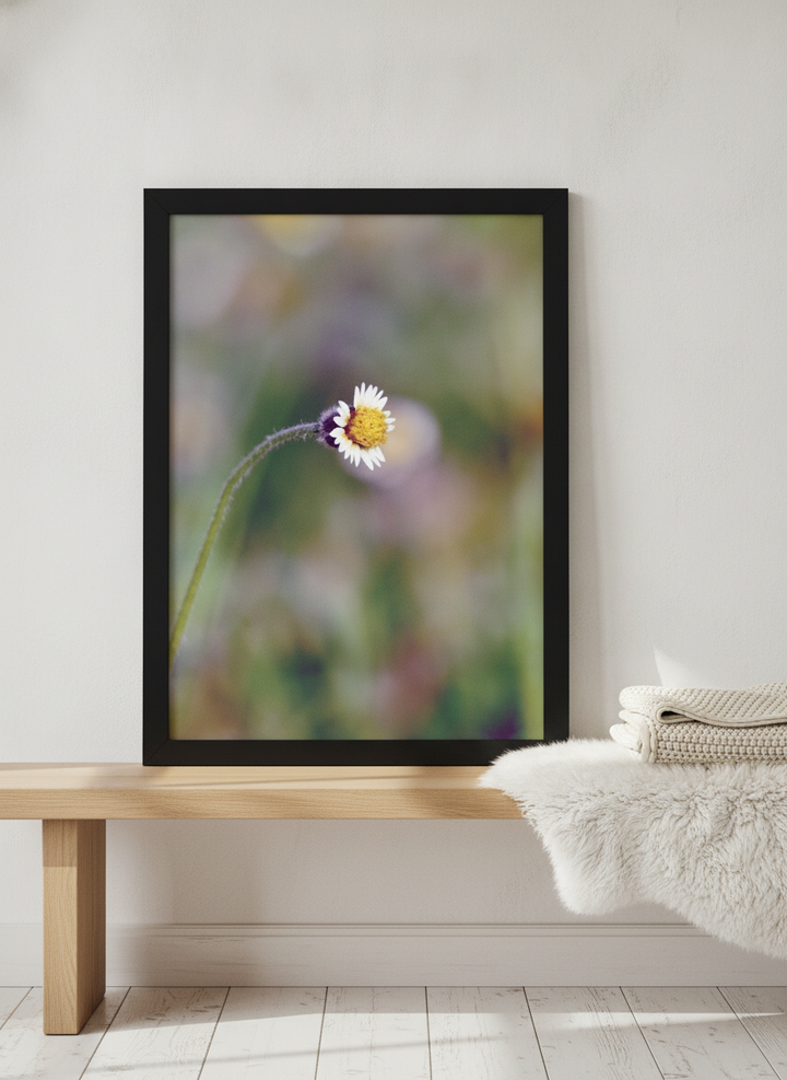 Modern wall art print standing on a bench in a bright Scandinavian bathroom