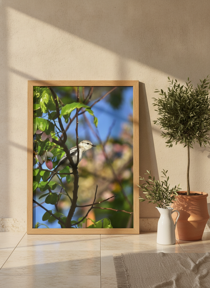 Modern wall art print leaning against the wall in a Mediterranean bathroom