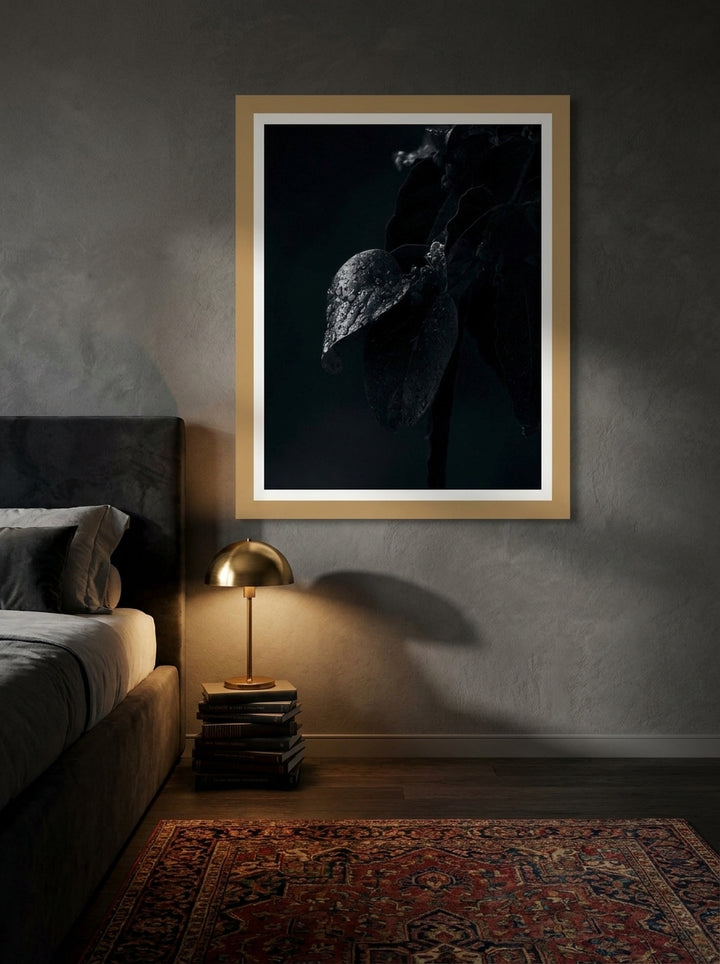 Modern wall art print styled on the wall in a moody bedroom