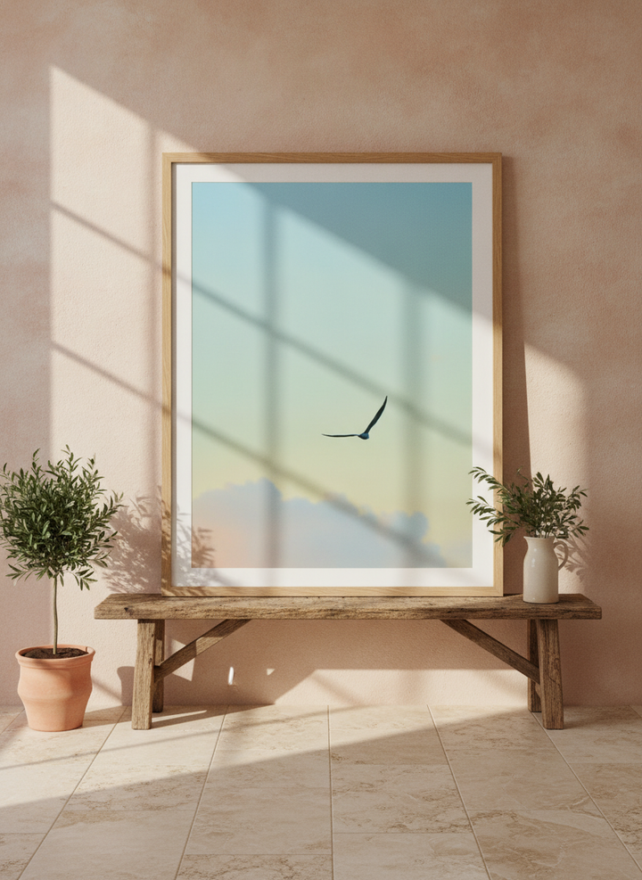 Modern wall art print standing on a bench in a Mediterranean bathroom