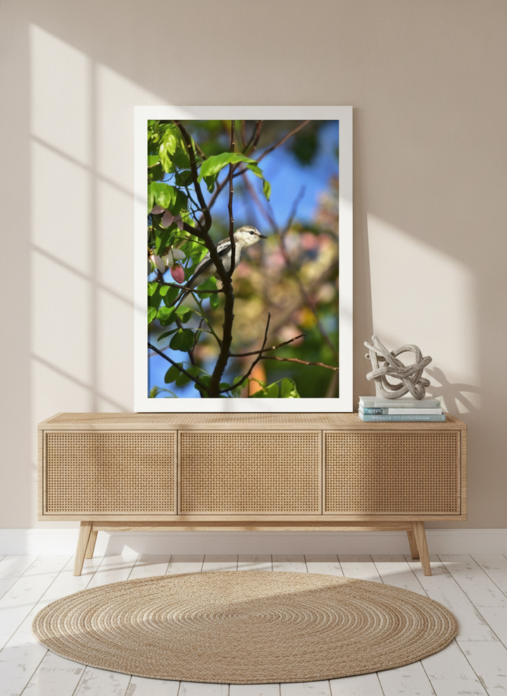 Modern wall art print standing on a sideboard in a coastal home office
