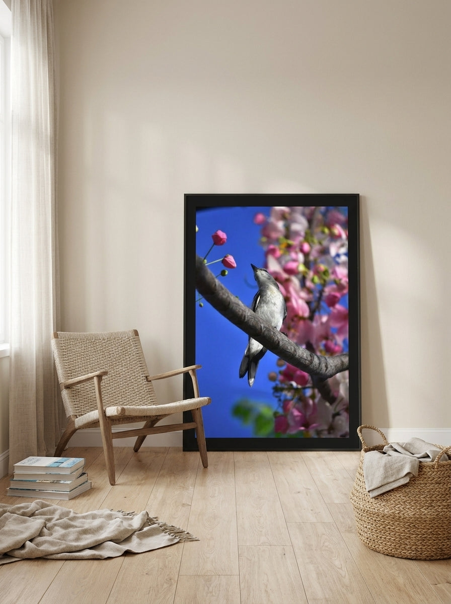 Oversized statement modern wall art print leaning against the wall in a coastal bedroom