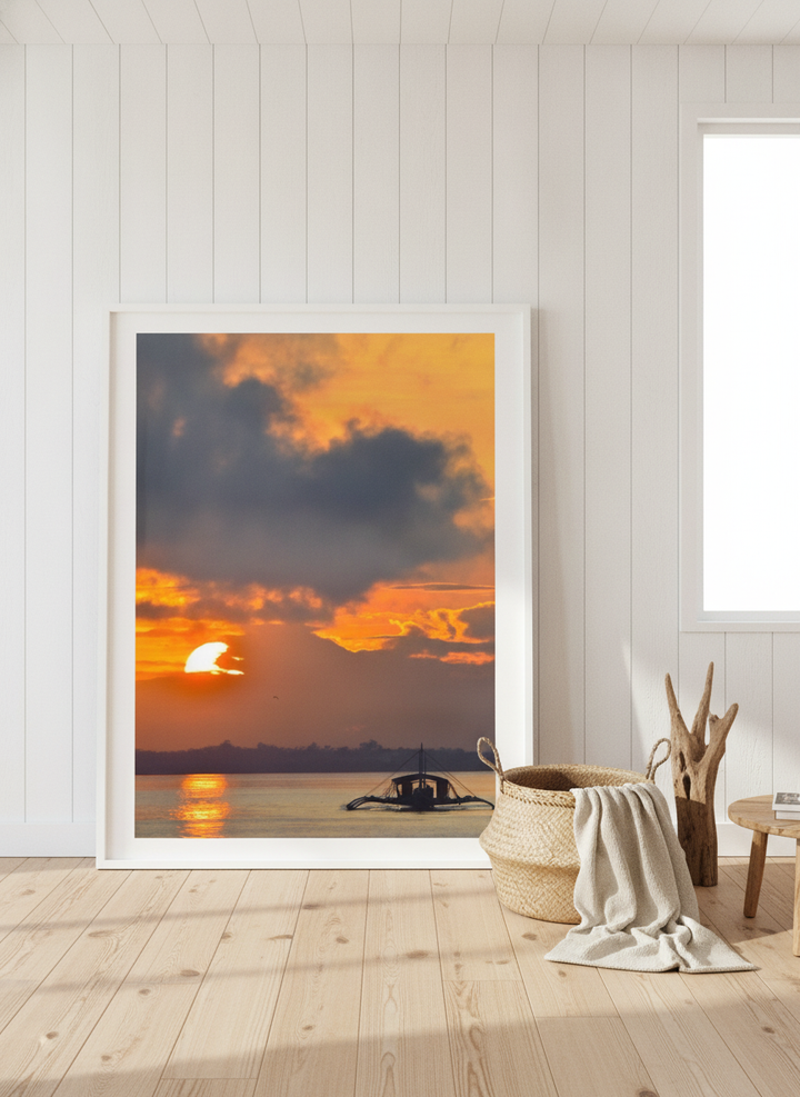 Oversized statement modern wall art print leaning against the wall in a coastal dining room