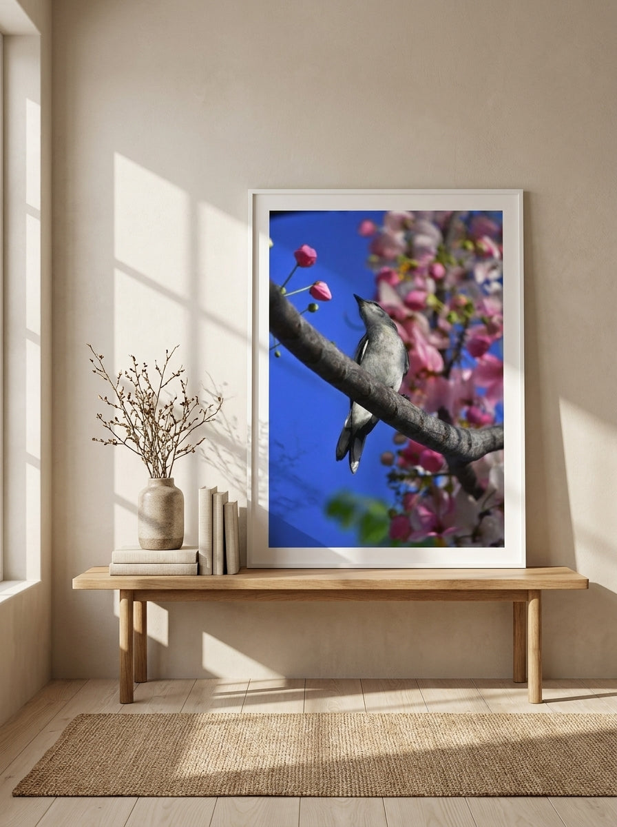 Modern wall art print standing on a bench in a warm Japandi bathroom