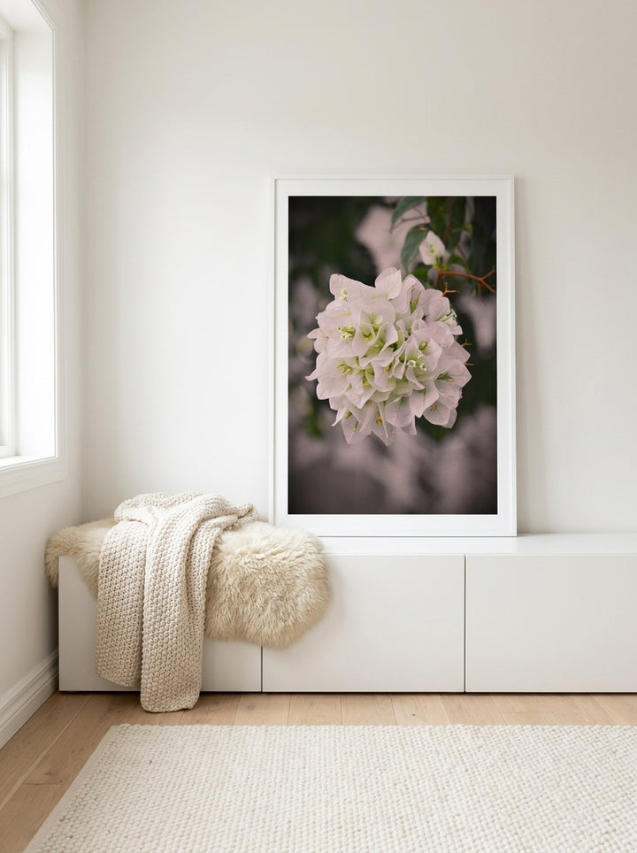 Modern wall art print standing on a sideboard in a bright Scandinavian bathroom