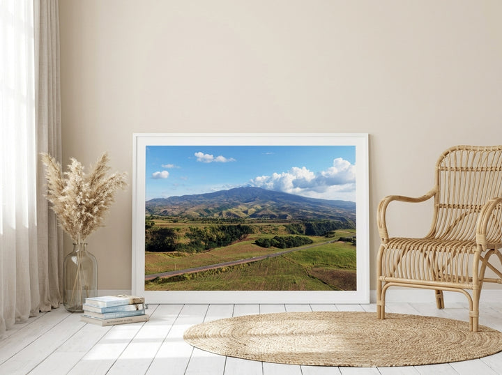 Modern wall art print leaning against the wall in a coastal bedroom