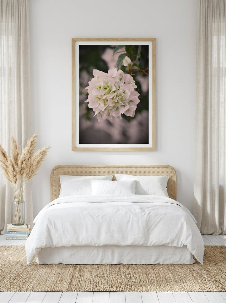 Modern wall art print styled on the wall in a coastal bedroom
