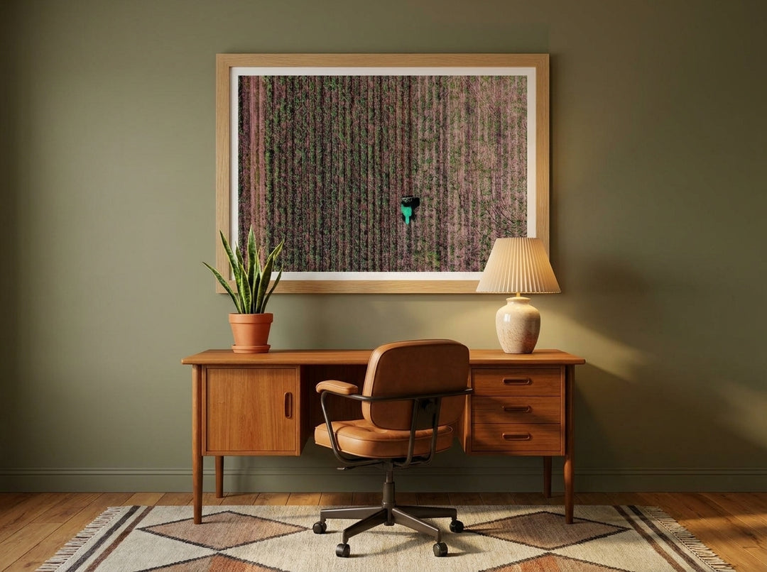 Modern wall art print styled on the wall in a mid-century home office