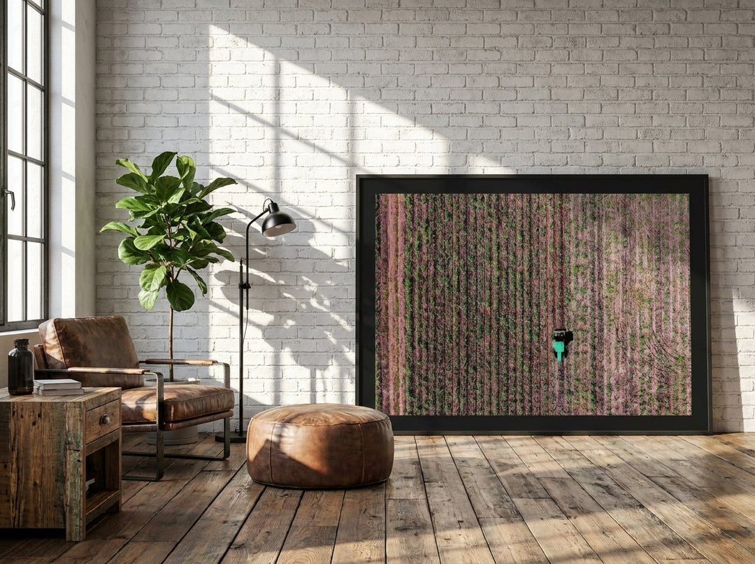 Oversized statement modern wall art print leaning against the wall in an industrial loft living room