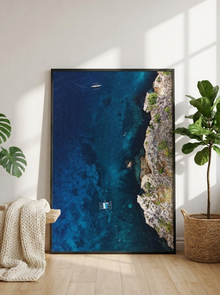 Oversized statement modern wall art print leaning against the wall in a bright Scandinavian home office