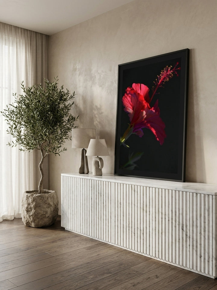 Modern wall art print standing on a sideboard in a luxe bedroom