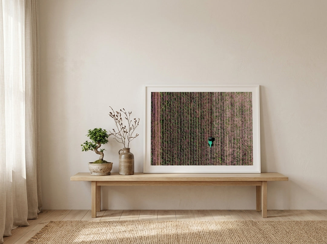 Modern wall art print standing on a bench in a warm Japandi living room