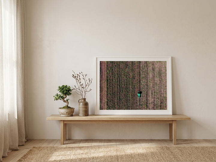 Modern wall art print standing on a bench in a warm Japandi living room