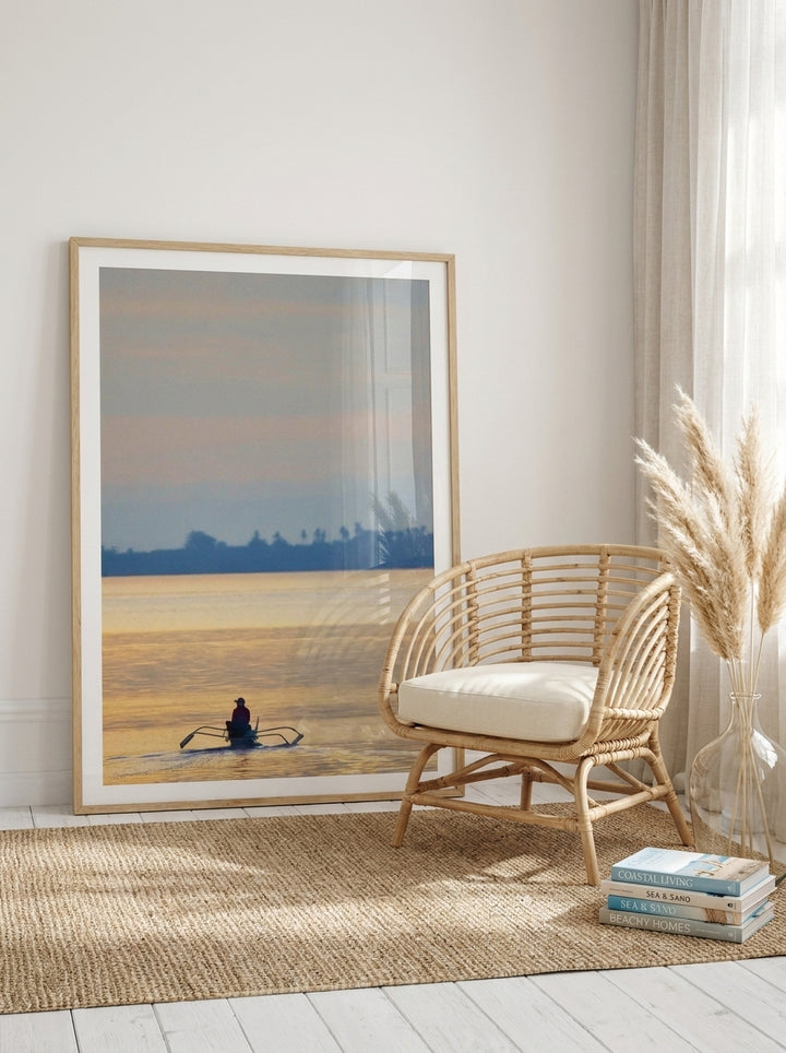 Oversized statement modern wall art print leaning against the wall in a coastal dining room