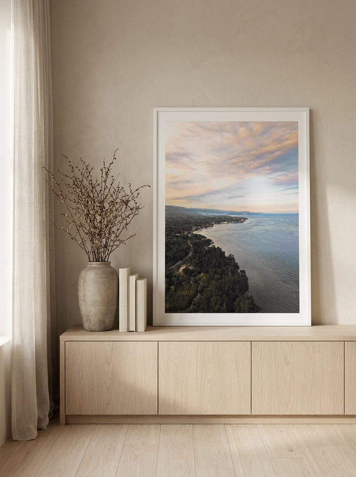 Modern wall art print standing on a sideboard in a warm Japandi bedroom