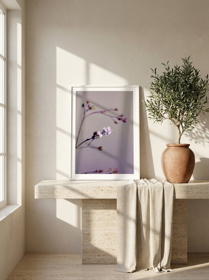 Modern wall art print standing on a console in a Mediterranean bedroom
