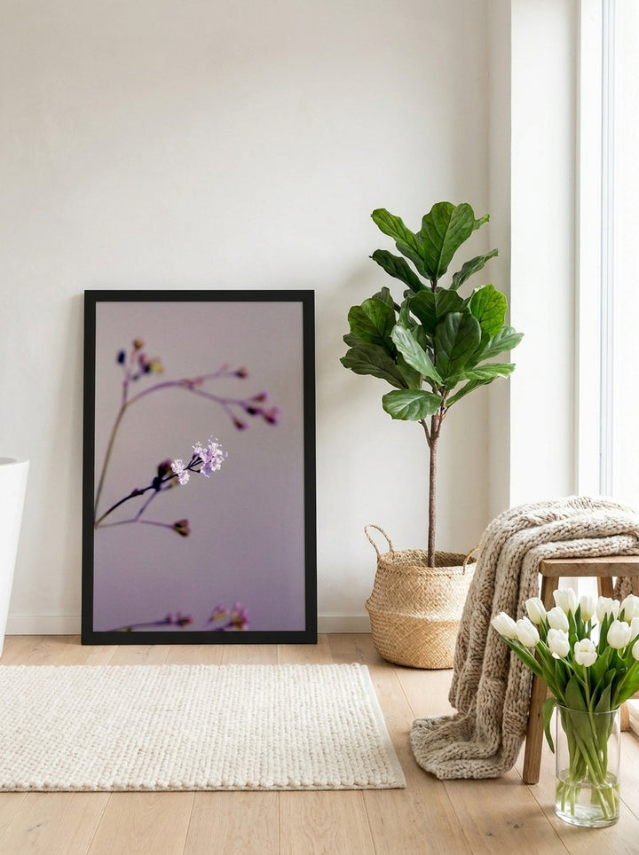 Modern wall art print leaning against the wall in a bright Scandinavian bathroom
