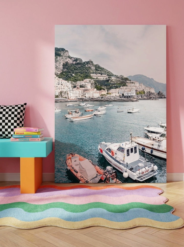 Stretched canvas wall art standing on a side table in a colourful eclectic living room