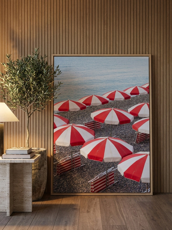 Oversized statement canvas wall art with a natural timber surround leaning against the wall in a luxe living room