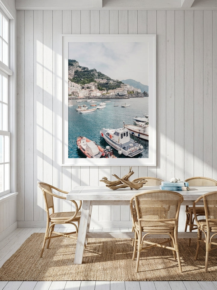 Oversized statement modern wall art print styled on the wall in a coastal dining room