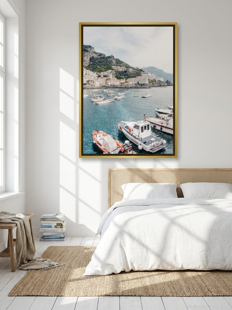 Oversized statement canvas wall art with a gold leaf surround styled on the wall in a coastal bedroom