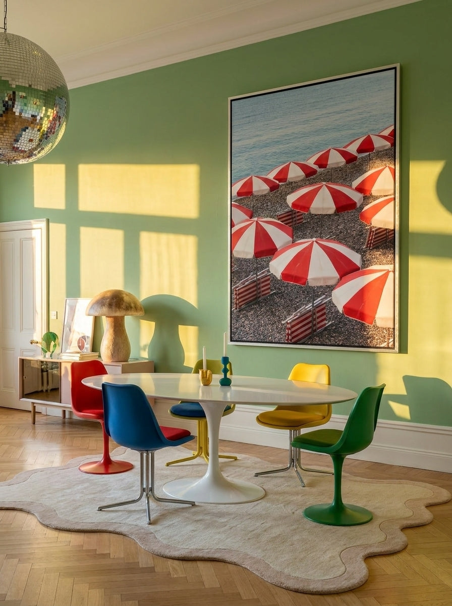 Oversized statement canvas wall art with a silver leaf surround styled on the wall in a colourful eclectic dining room