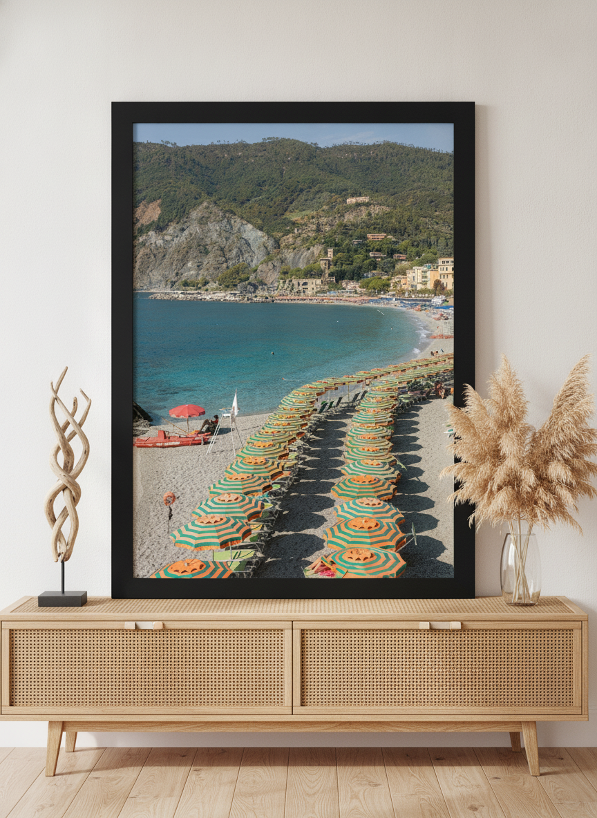 Modern wall art print standing on a sideboard in a coastal bedroom