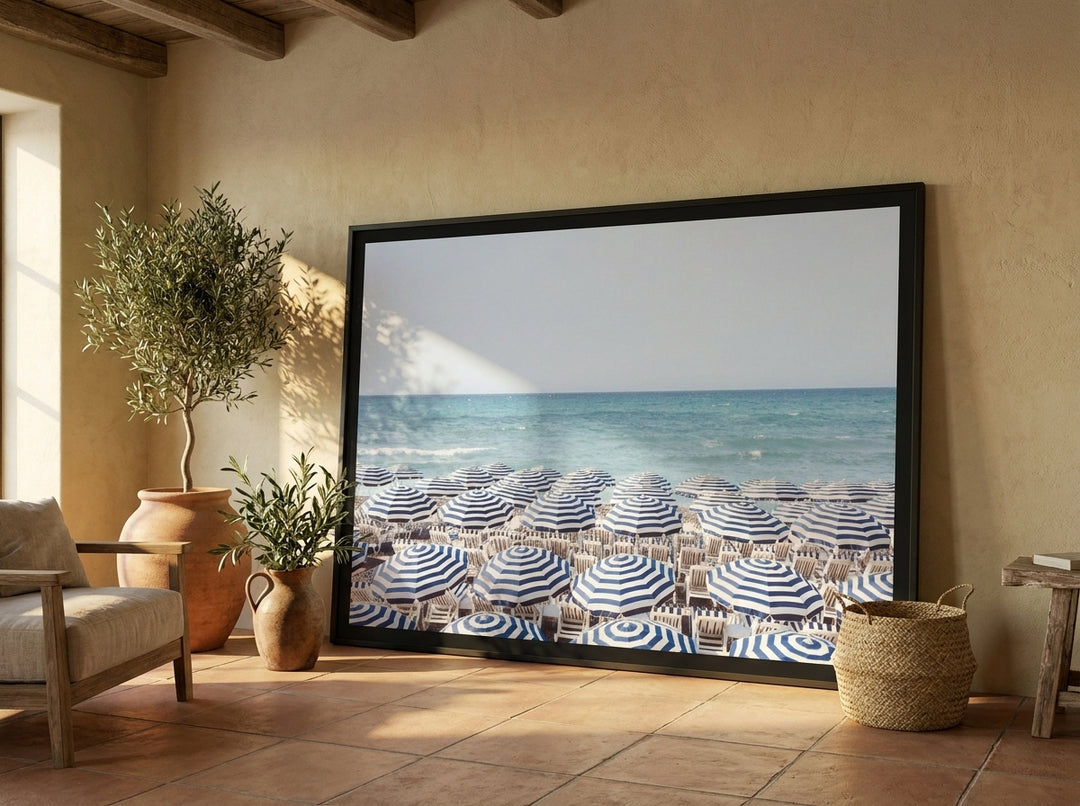 Oversized statement modern wall art print leaning against the wall in a Mediterranean living room
