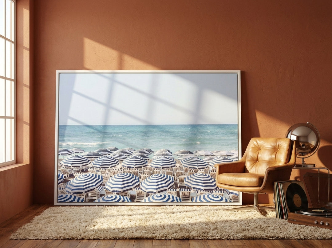 Oversized statement canvas wall art with a white surround leaning against the wall in a retro 70s dining room