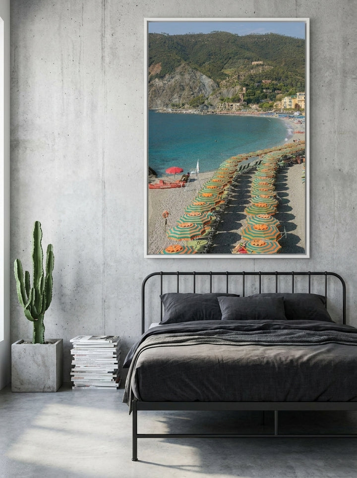 Canvas wall art with a white surround styled on the wall in an industrial loft bedroom