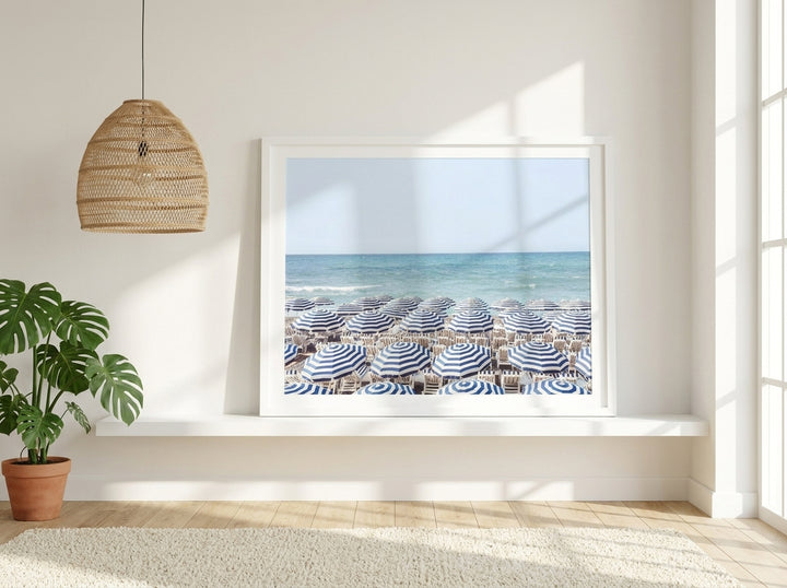 Modern wall art print standing on a shelf in a bright Scandinavian bedroom