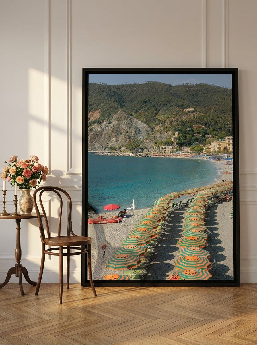 Oversized statement canvas wall art with a black surround leaning against the wall in a Parisian living room