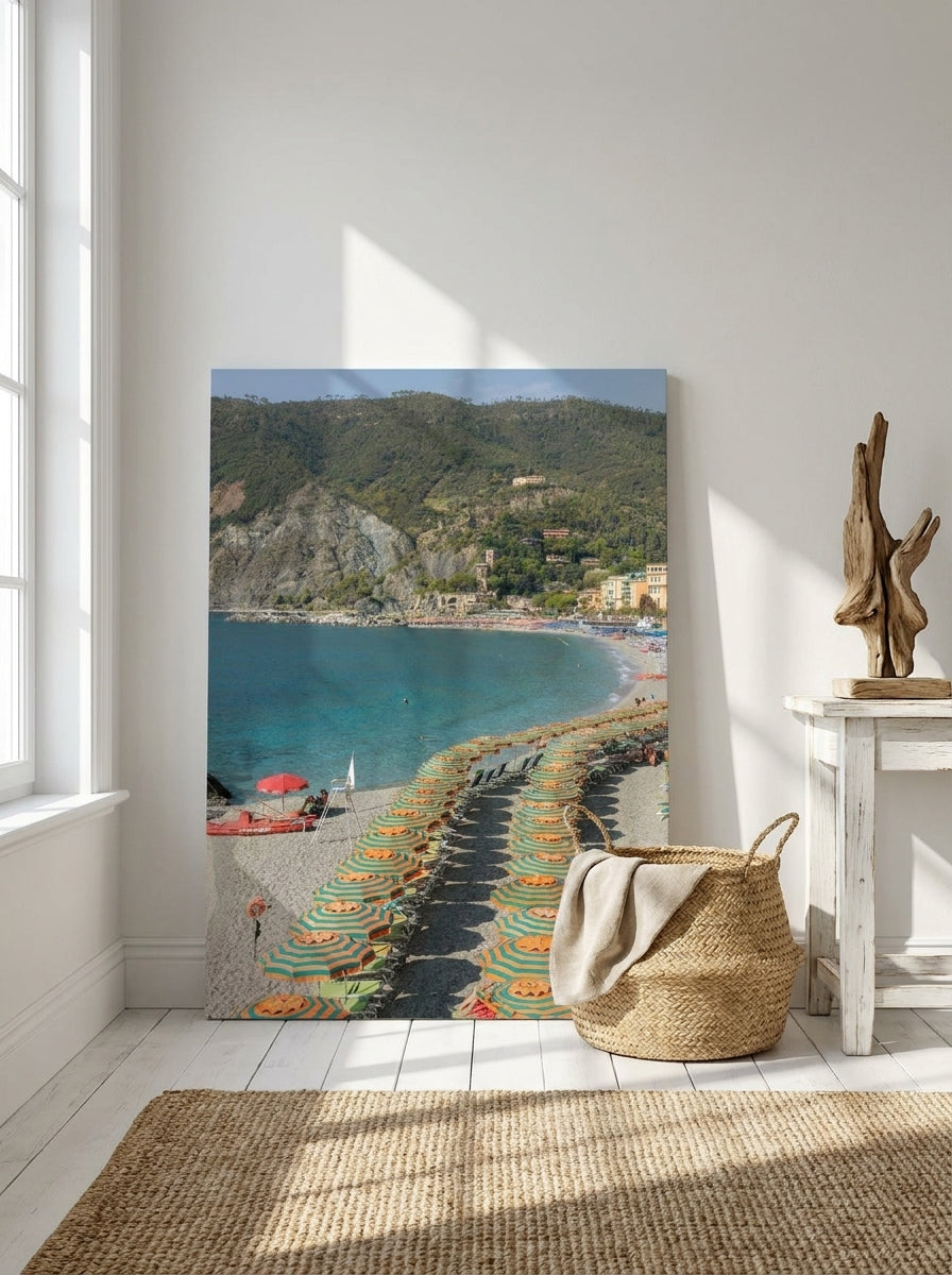 Stretched canvas wall art leaning against the wall in a coastal bedroom