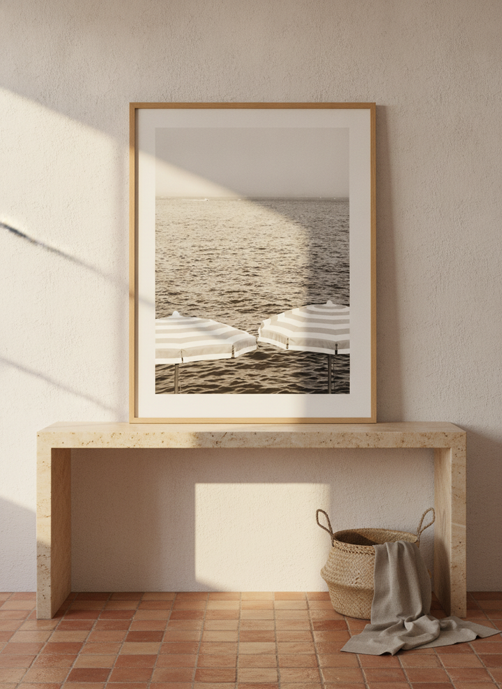 Modern wall art print standing on a console in a Mediterranean bathroom