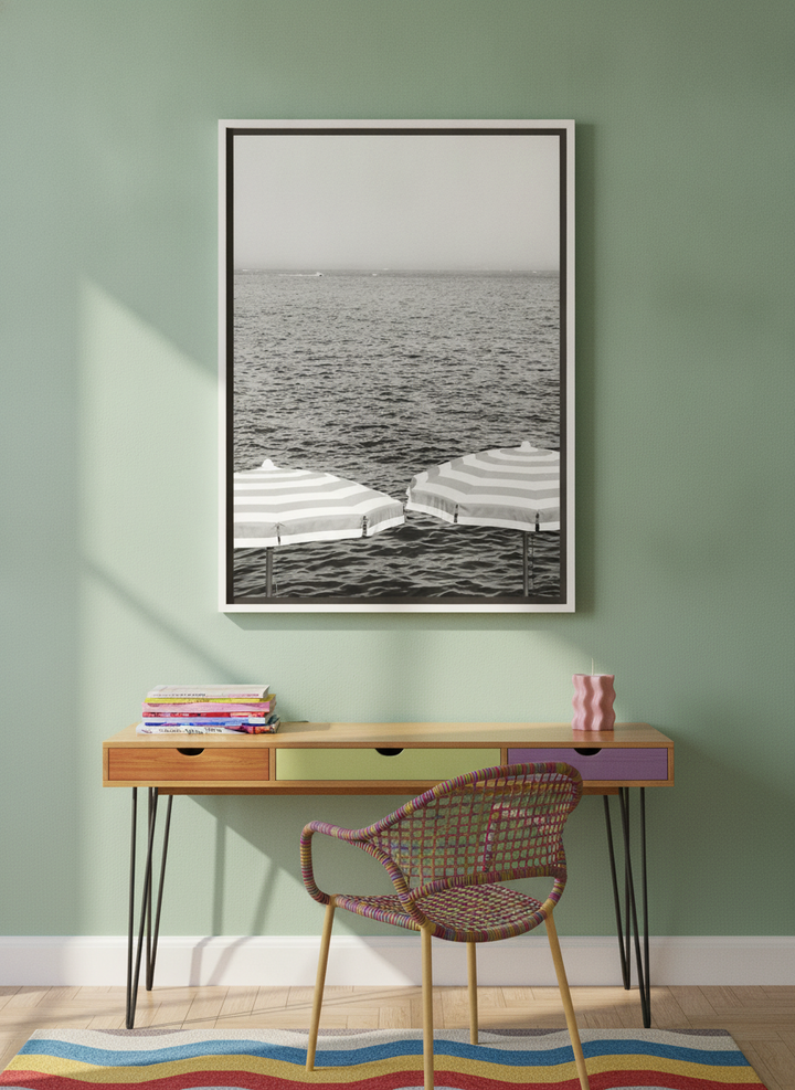 Canvas wall art with a white surround styled on the wall in a colourful eclectic home office