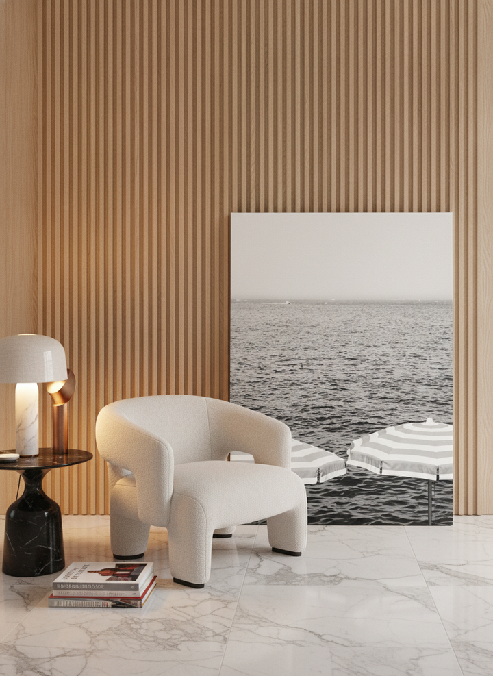Stretched canvas wall art leaning against the wall in a luxe living room