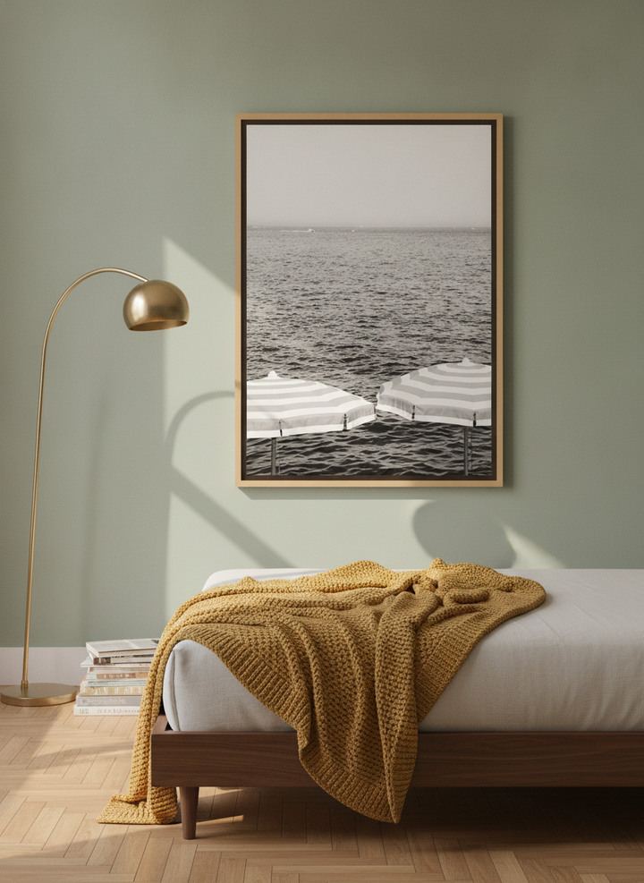 Oversized statement canvas wall art with a natural timber surround styled on the wall in a mid-century bedroom