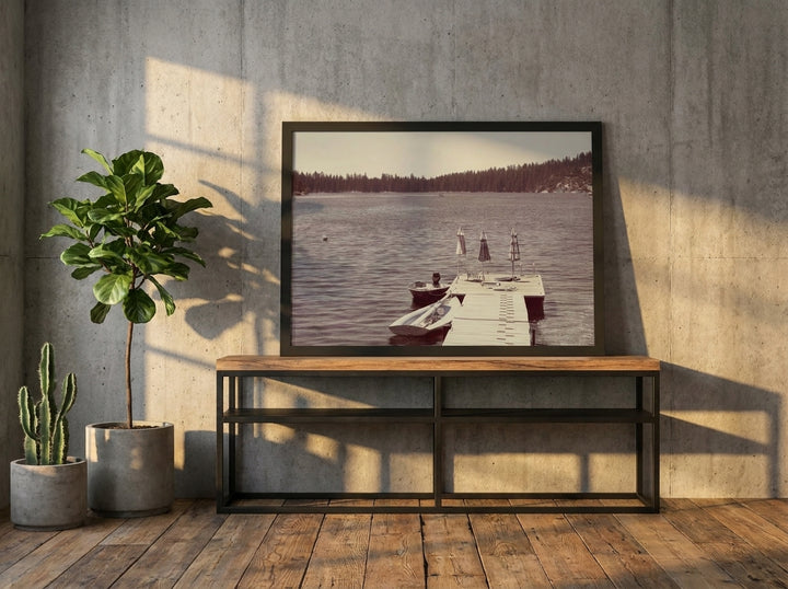 Modern wall art print standing on a console in an industrial loft dining room