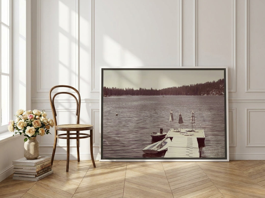 Canvas wall art with a white surround leaning against the wall in a Parisian dining room