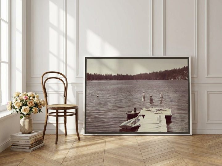 Canvas wall art with a white surround leaning against the wall in a Parisian dining room