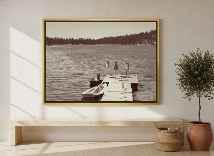 Oversized statement canvas wall art with a gold leaf surround styled on the wall in a Mediterranean living room